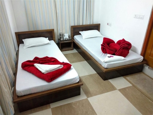 Book AC DELUXE [Two Single Beded] at GREEN WOOD HOTEL, Siliguri