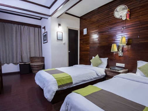 Book Non-AC Deluxe Rooms ( Twin bed) at The Nettle and Fern Hotel, Sikkim
